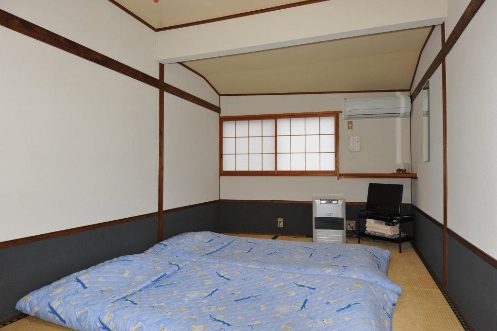 Chambre Triple de Style Japonais avec Salle de Bains Commune